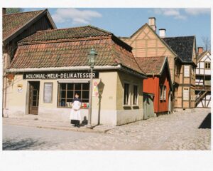 a woman standing in front of a building