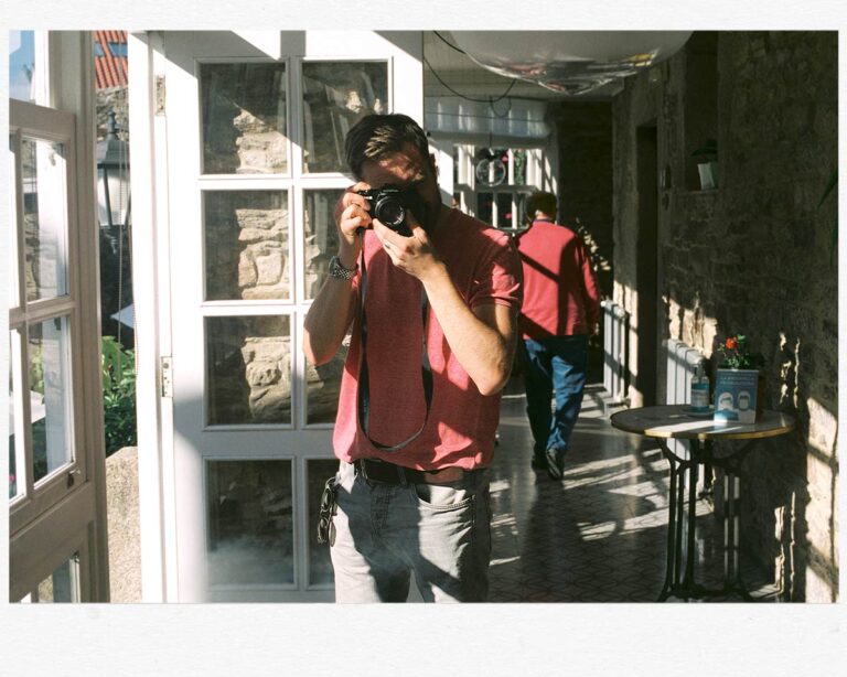 a man taking a picture with a camera