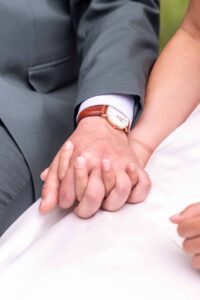 a man and woman holding hands