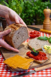 a person holding a loaf of bread