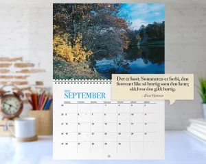 a calendar with a picture of trees and a river