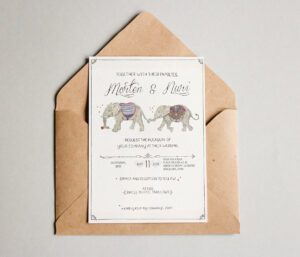 a envelope with a card and a picture of elephants